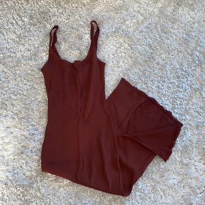 Skin tight, burgundy red, scoop neck, below the knees dress. Spandex material